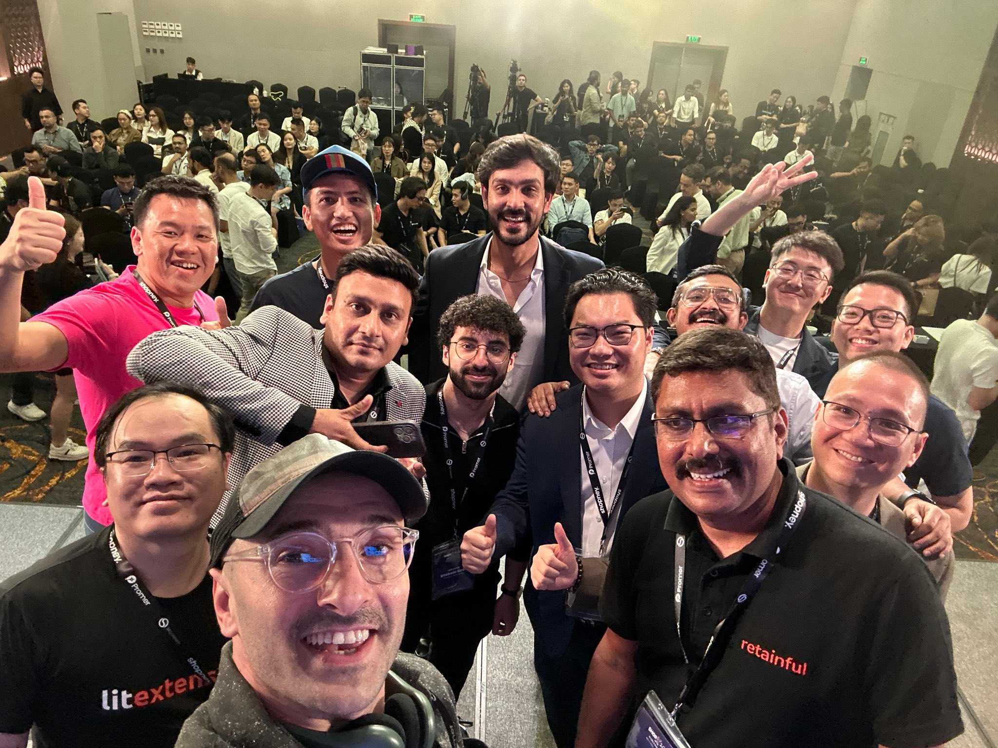 International team selfie at ShopX