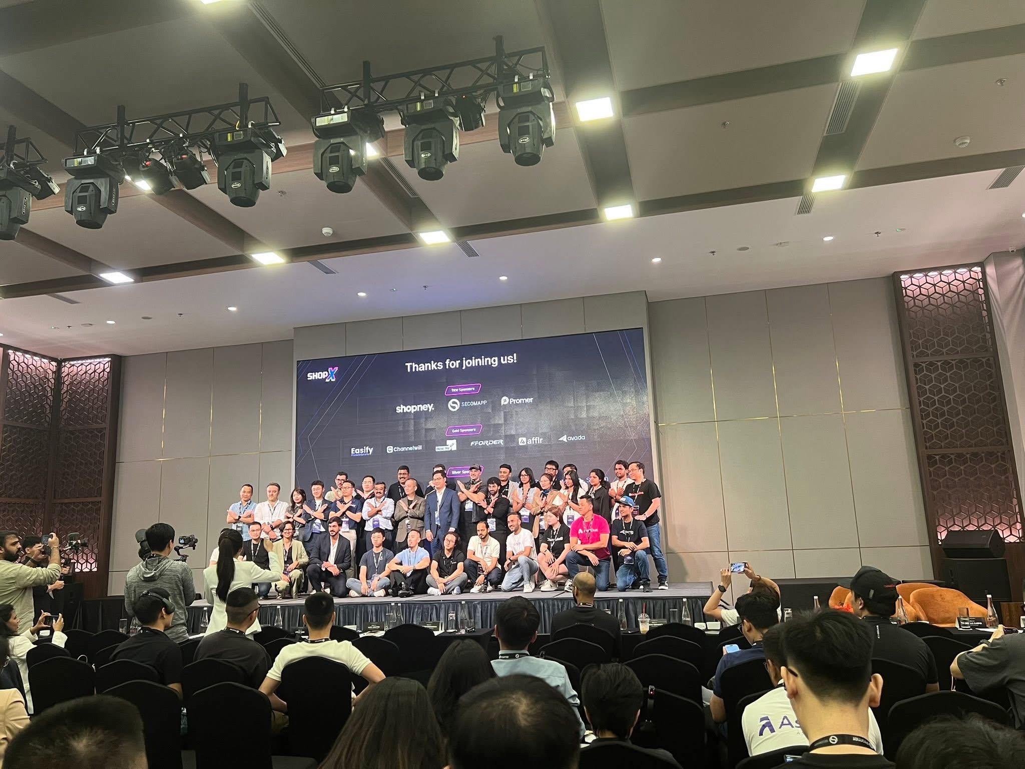 ShopX Singapore — full ecosystem on stage with sponsor logos